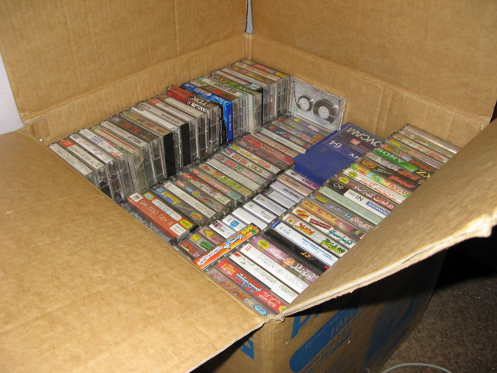 Cardboard box full of cassette audio tapes